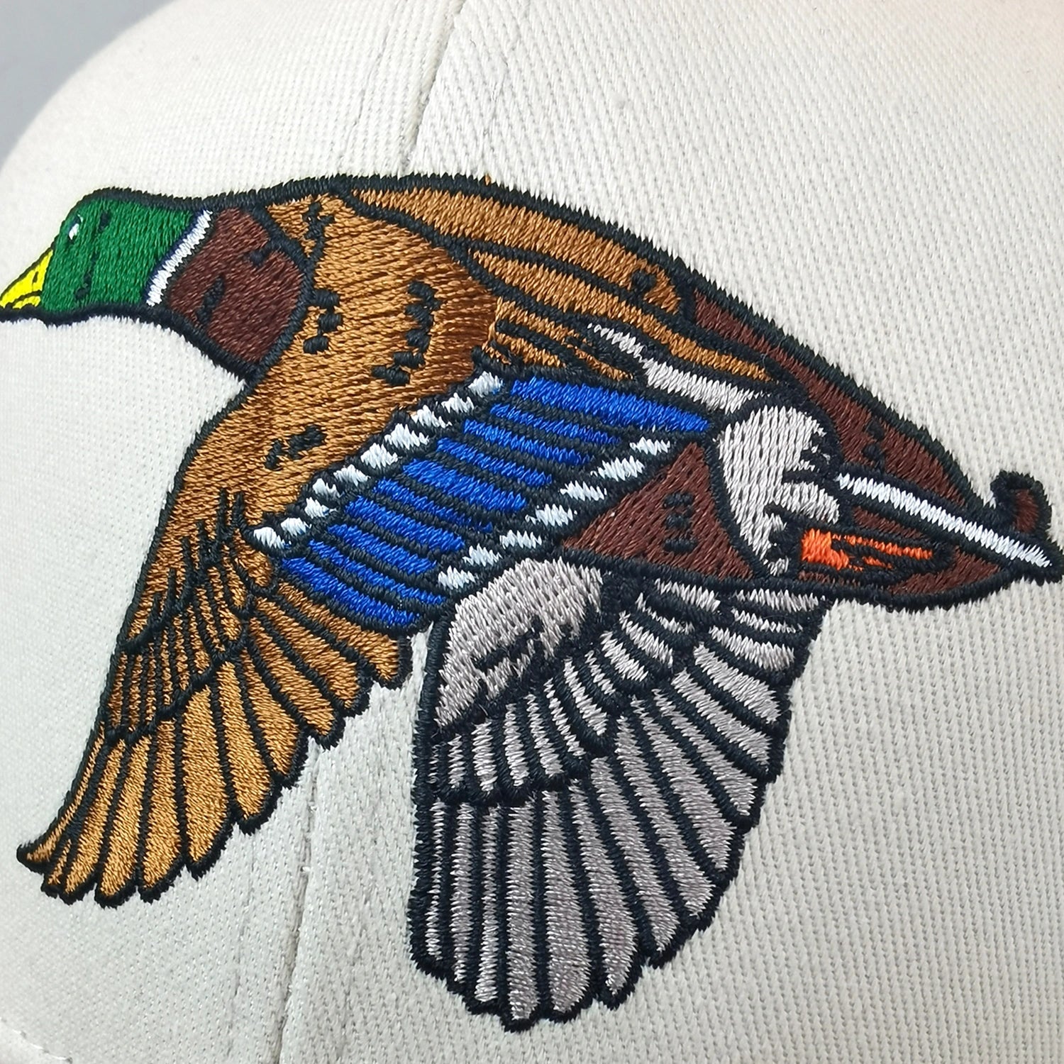 Embroidered duck design on a white background